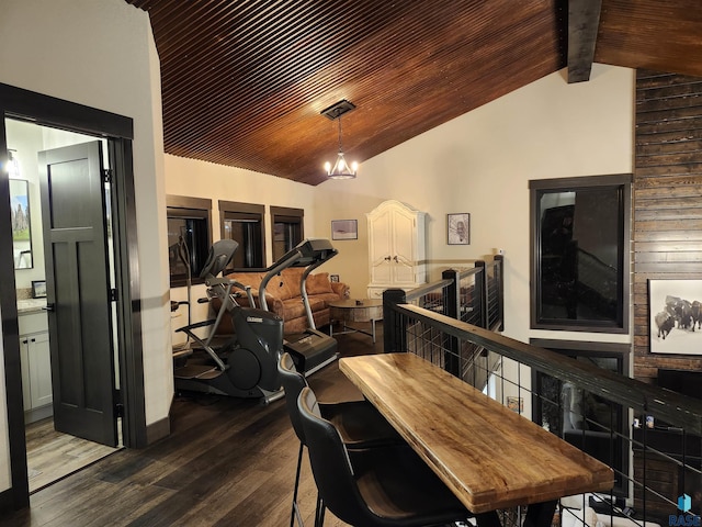 dining space featuring wood ceiling, a notable chandelier, dark hardwood / wood-style flooring, and vaulted ceiling with beams