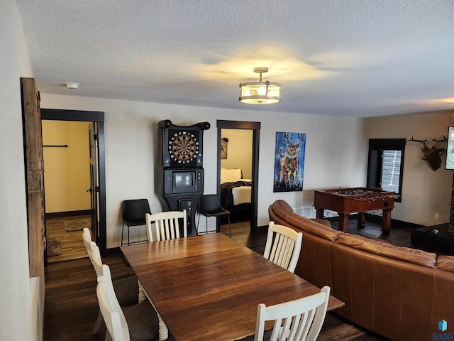 dining space featuring a textured ceiling