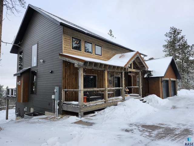 view of front of house with a garage and covered porch