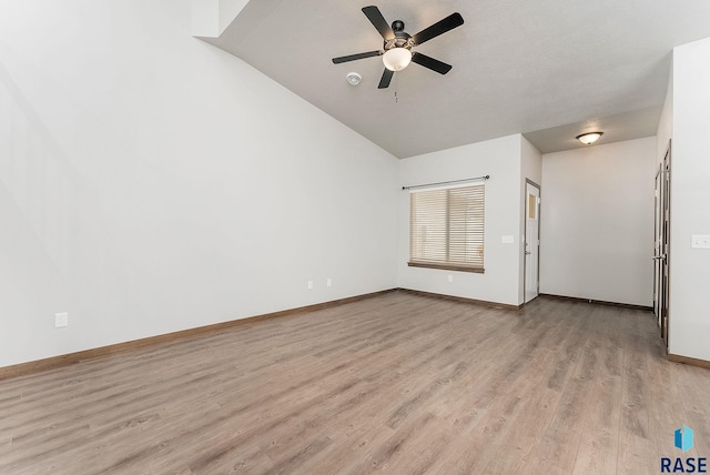 unfurnished living room with light hardwood / wood-style flooring, ceiling fan, and vaulted ceiling