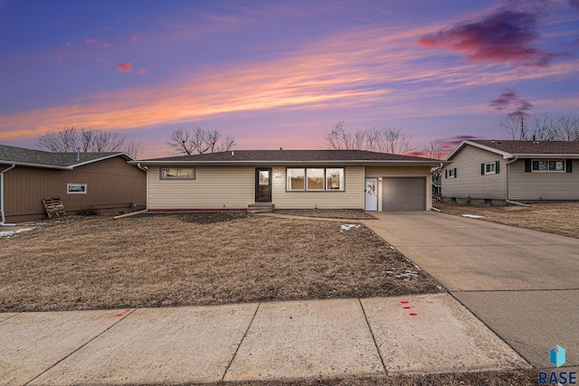 single story home with a garage