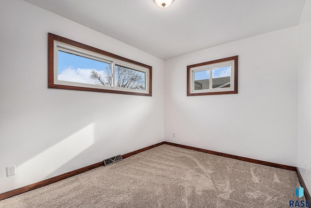 unfurnished room with carpet floors