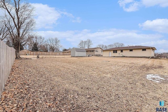 view of yard with a storage unit