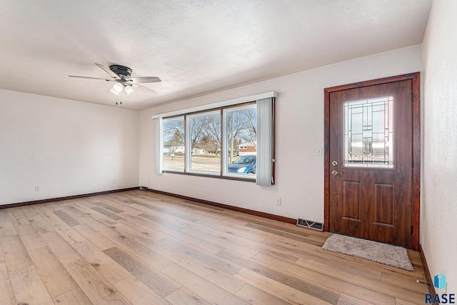 entryway featuring ceiling fan and light hardwood / wood-style flooring