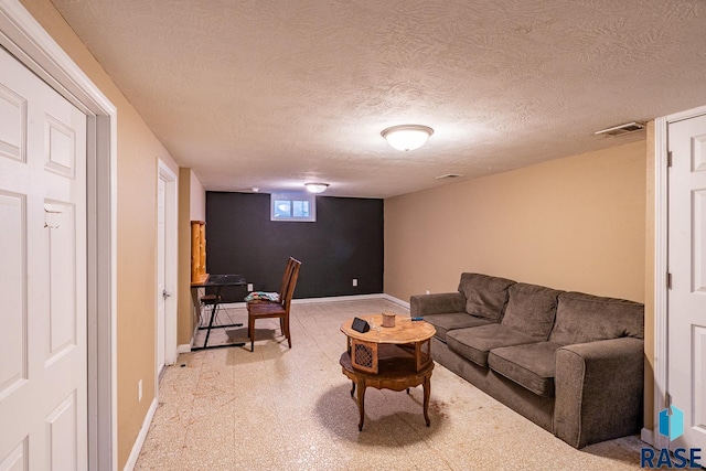 living room with a textured ceiling