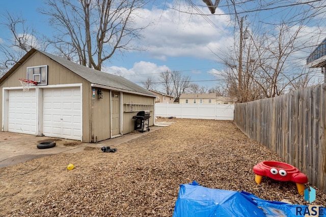 view of yard with a garage and an outdoor structure