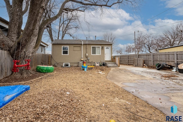 back of property with a patio area