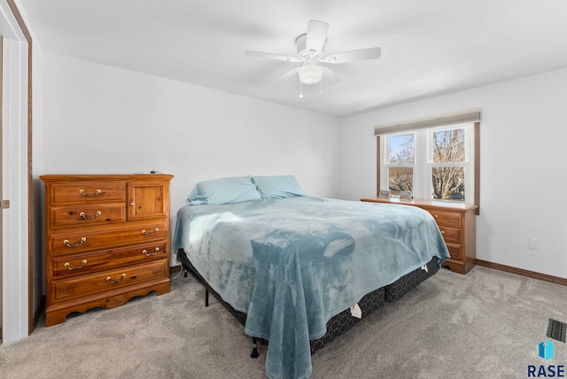 carpeted bedroom featuring ceiling fan