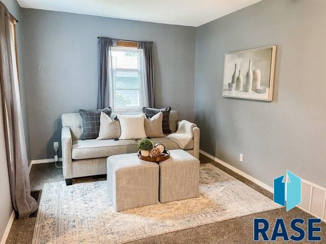 sitting room featuring carpet flooring