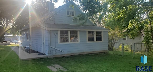 view of home's exterior featuring a yard