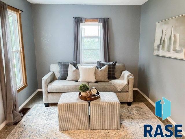 sitting room featuring carpet floors