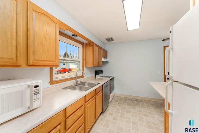 kitchen with sink and white appliances