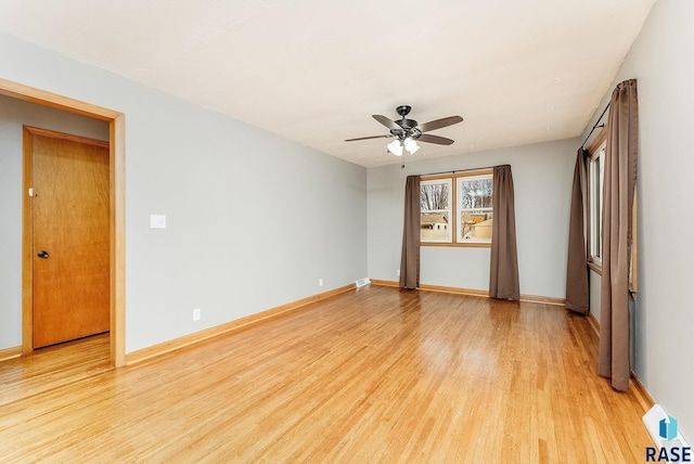 spare room with light hardwood / wood-style floors and ceiling fan