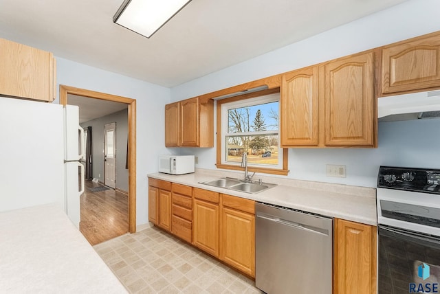 kitchen featuring sink and white appliances