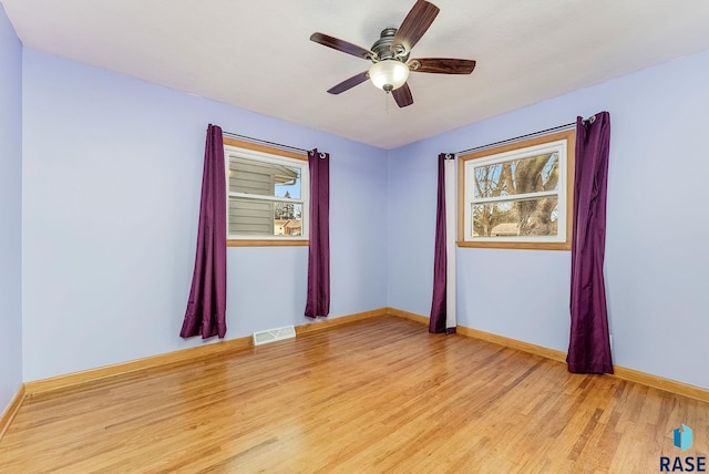 unfurnished room featuring ceiling fan and light hardwood / wood-style floors