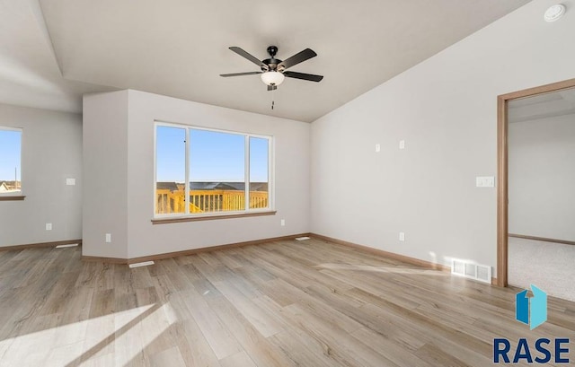 unfurnished room with ceiling fan, a healthy amount of sunlight, and light hardwood / wood-style flooring