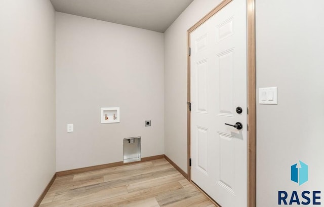 laundry area featuring washer hookup, hookup for an electric dryer, and light hardwood / wood-style floors