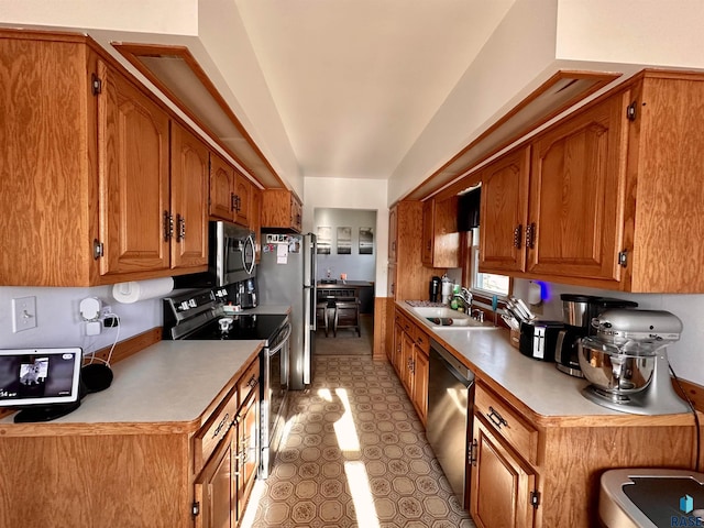 kitchen with sink and appliances with stainless steel finishes