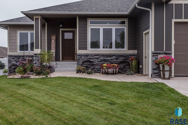 property entrance with a yard