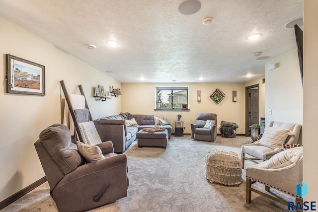 carpeted living room featuring a textured ceiling