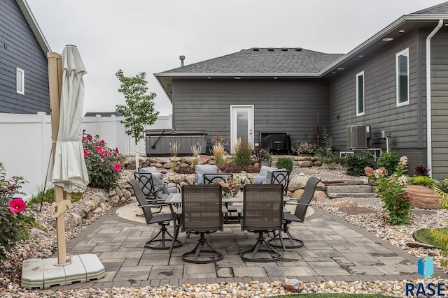 view of patio featuring a hot tub and central AC unit