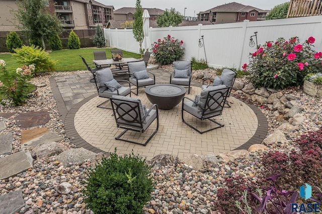 view of patio featuring an outdoor fire pit