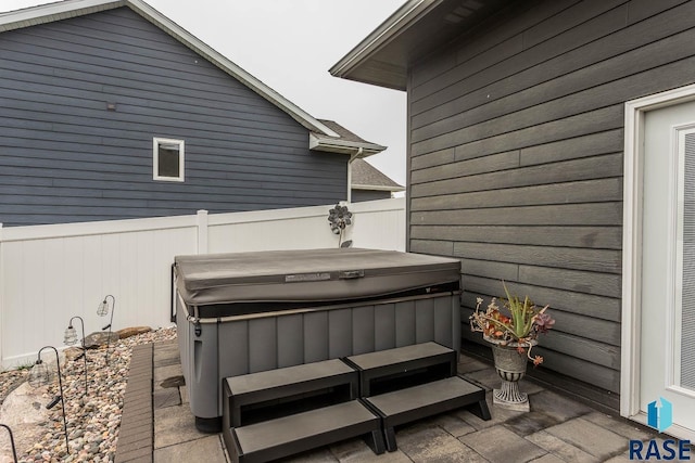 view of patio with a hot tub