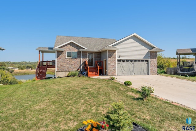 view of front of home featuring a garage and a front yard