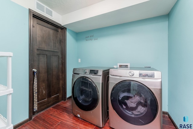 clothes washing area featuring washing machine and dryer