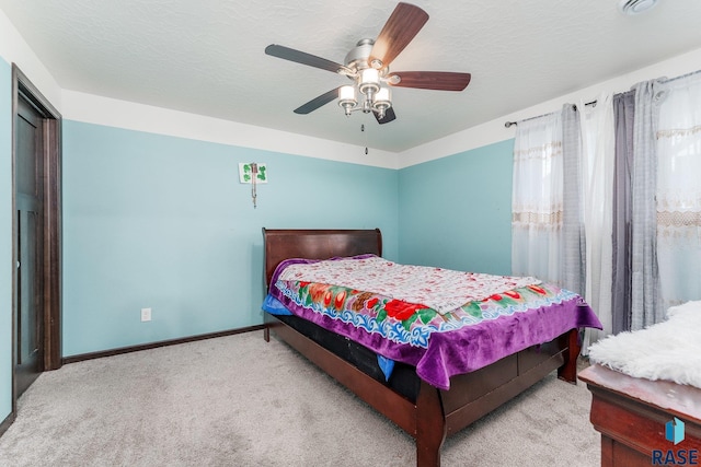 bedroom with light carpet and ceiling fan