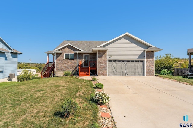 view of front facade featuring a garage and a front lawn