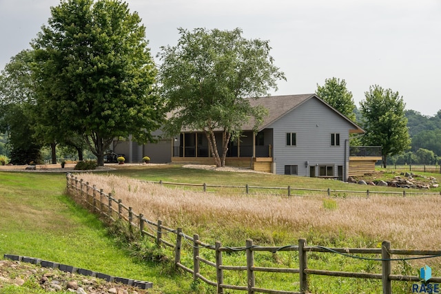 view of yard with a rural view