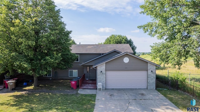 view of front facade with a garage and a front yard