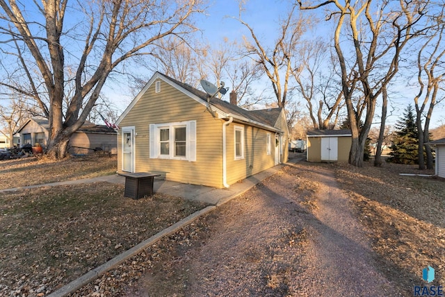 view of side of property with a shed