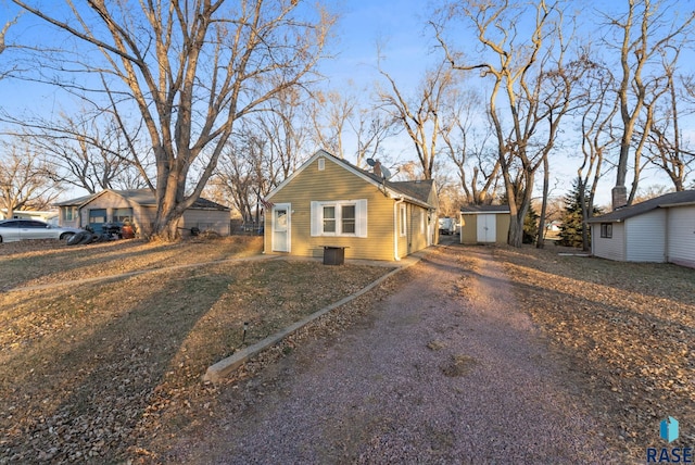 view of front of house with a storage shed