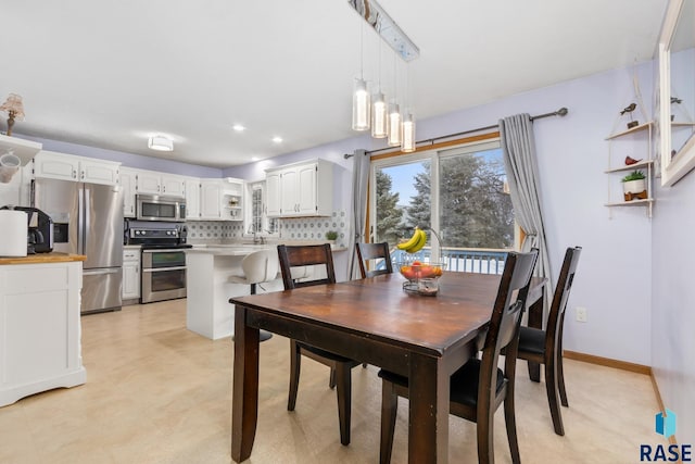 dining room featuring sink