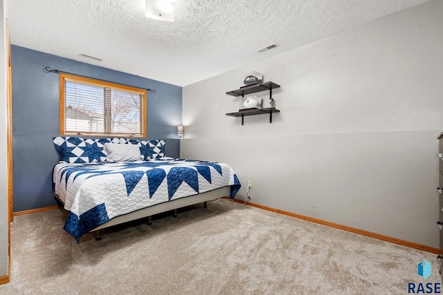 carpeted bedroom with a textured ceiling