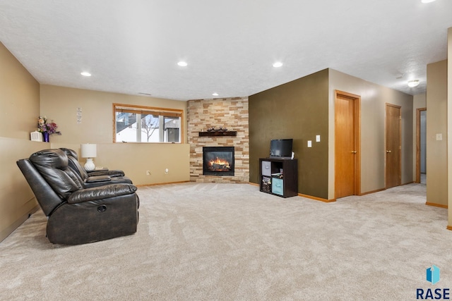 living room featuring light colored carpet and a fireplace