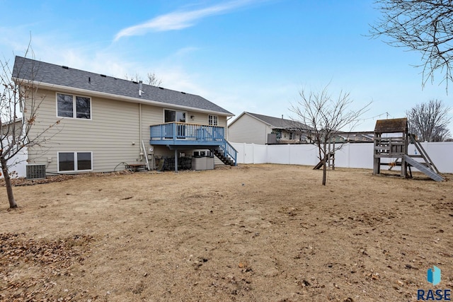 rear view of property with central AC and a deck