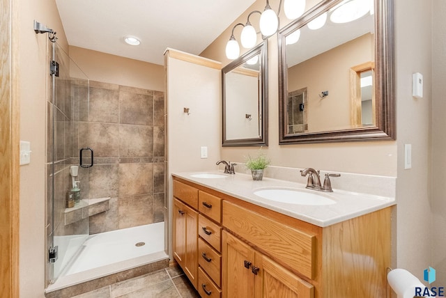 bathroom with vanity, tile patterned floors, and a shower with door