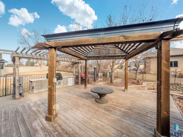 wooden terrace featuring exterior kitchen