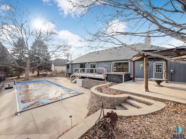 view of pool featuring a hot tub, a patio, and a deck