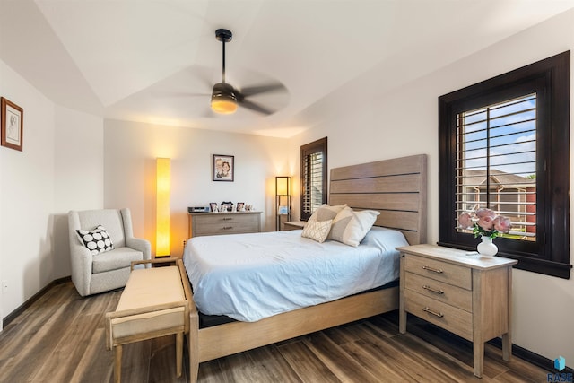 bedroom featuring dark hardwood / wood-style floors and ceiling fan