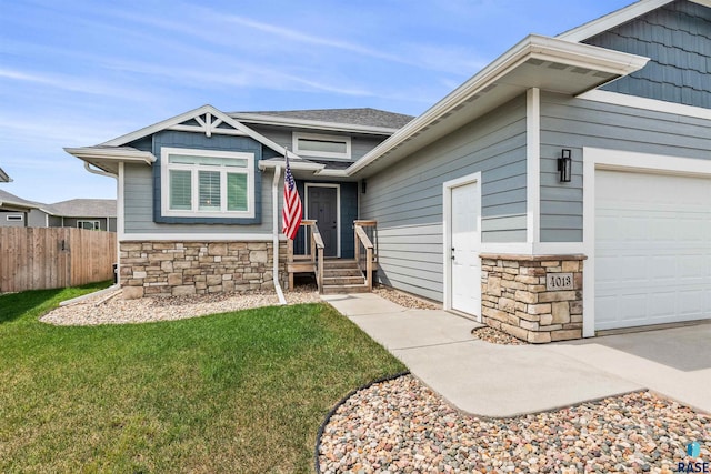 view of front of home featuring a garage and a front lawn