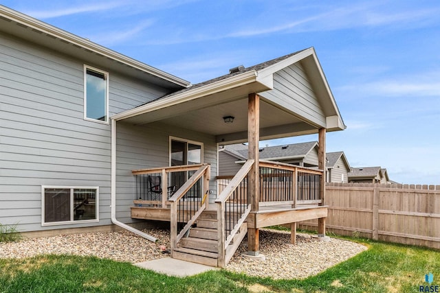 entrance to property featuring a wooden deck