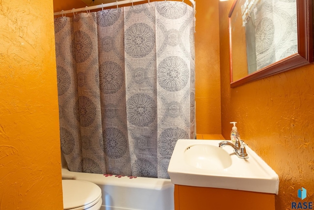 full bathroom with vanity, shower / bath combination with curtain, and toilet