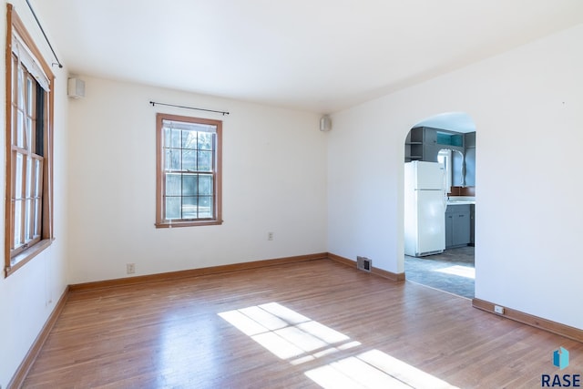 spare room featuring light hardwood / wood-style flooring