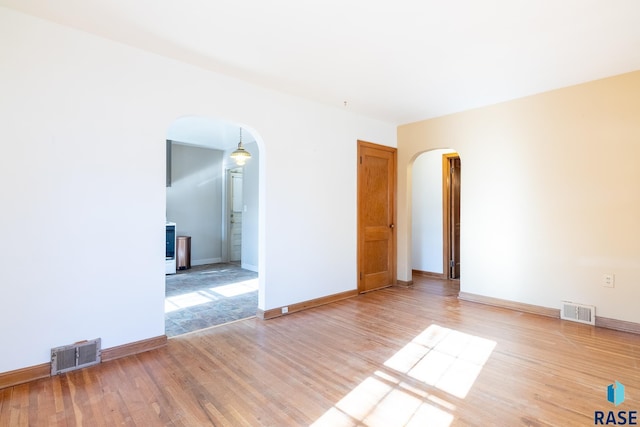 spare room featuring hardwood / wood-style floors