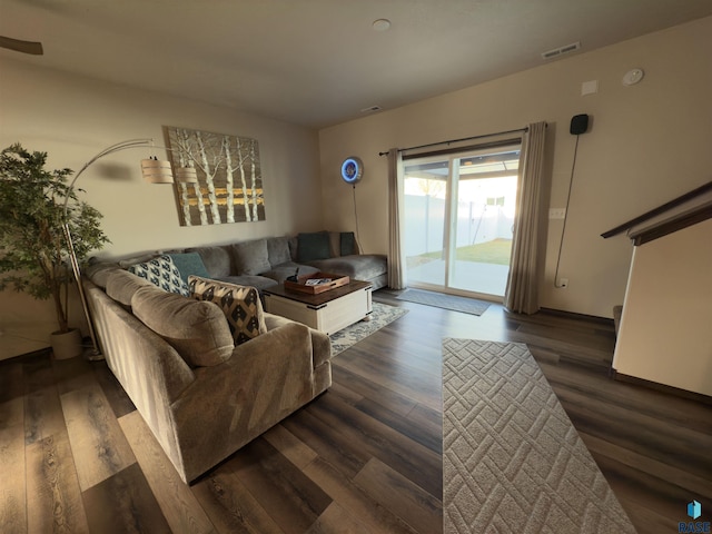 living room with dark hardwood / wood-style floors