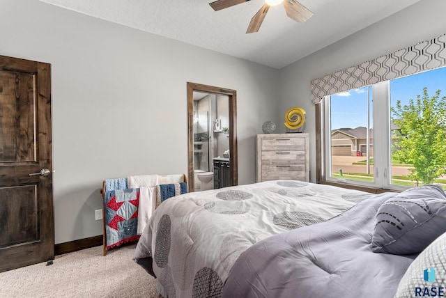 carpeted bedroom featuring a textured ceiling and ceiling fan